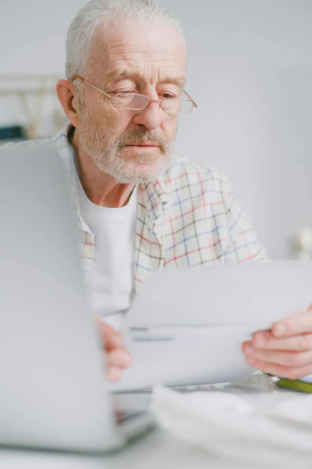 A council member reviewing a strata management fee statement